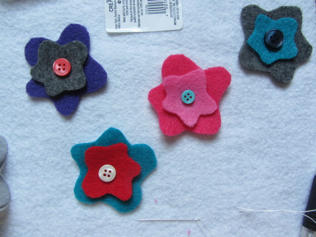 Pick out buttons to go with each felt flower.
