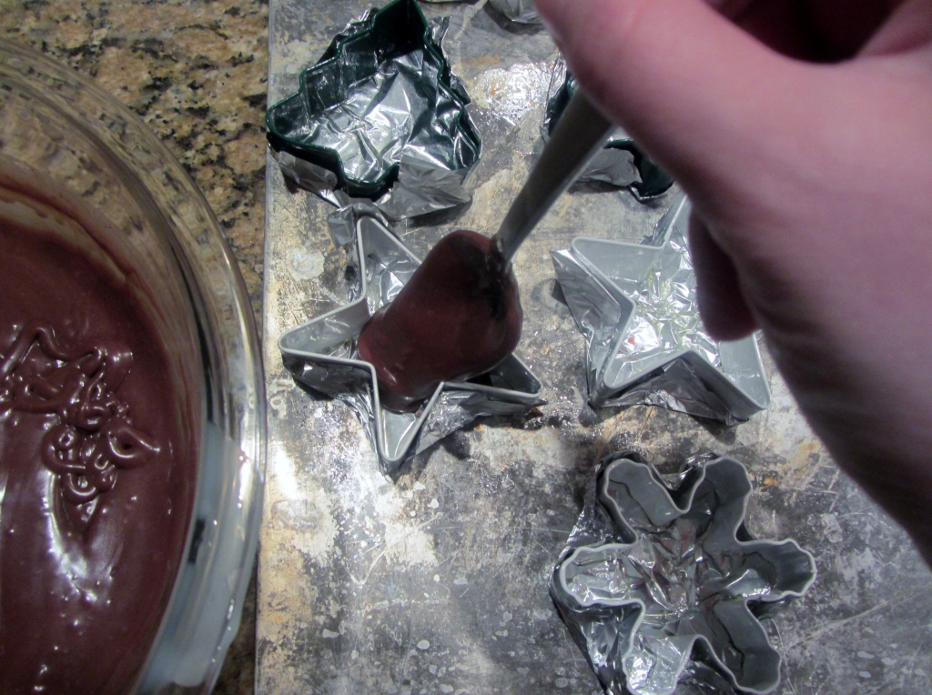 Spoon the fudge into your cookie cutters.